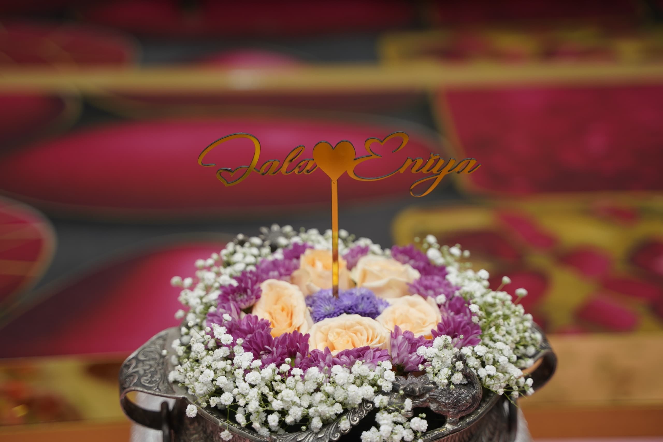 Floral arrangement with Jala & Eniya topper